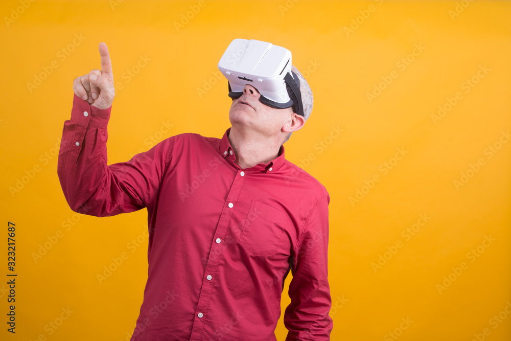 man with 3d virtual reality glasses pointing at what he sees in space, new technology concept man with 3d virtual reality glasses pointing at what he sees in space, new technology concept