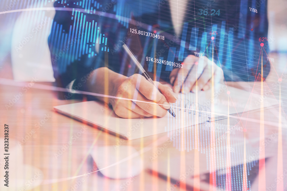 Forex graph on hand taking notes background. Concept of research. Multi exposure Forex graph on hand taking notes background. Concept of research. Multi exposure