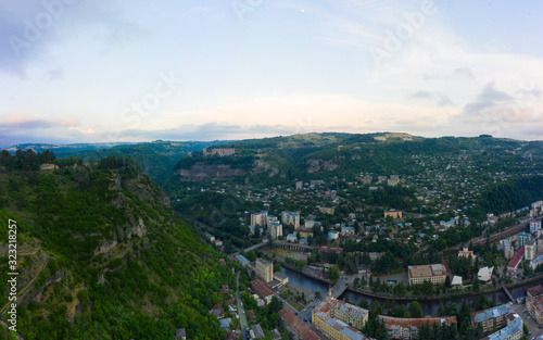 The city of Chiatura located in the gorge of the Kvirila River, a tributary of the Rioni and on adjacent plateaus. Panorama of the city district and Upper cable car station Perevisa.