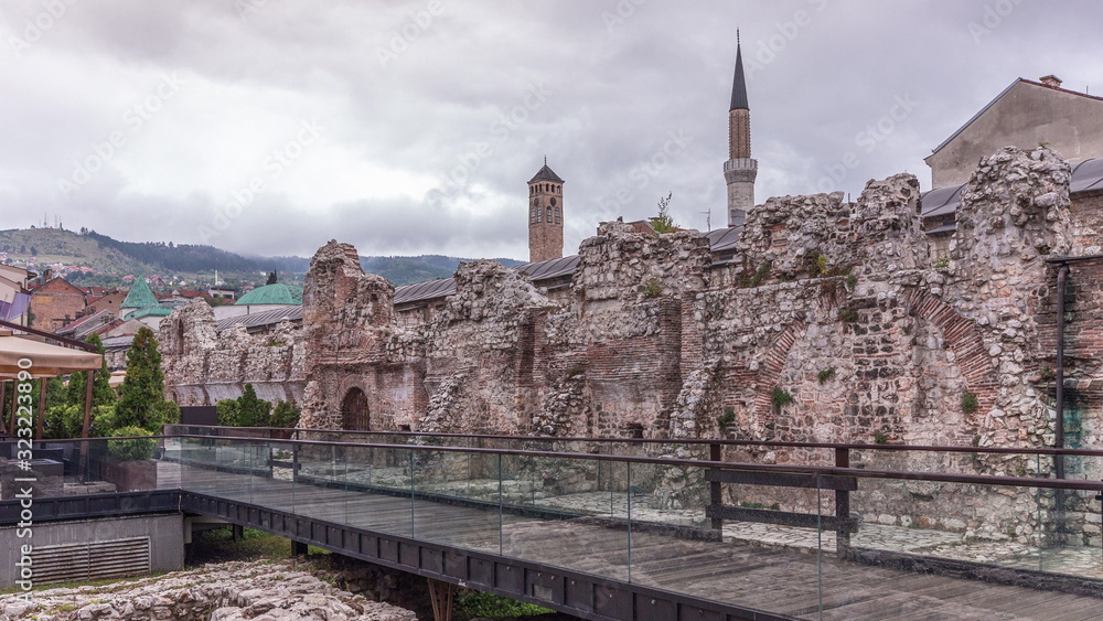 Historical Taslihan ruins timelapse with the old watch tower and minaret of Gazi Husrev mosque