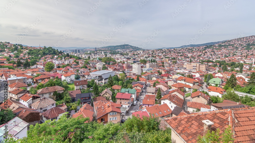 Obraz premium City panorama with cable car moving up and down from Sarajevo station to mountains, Bosnia And Herzegovina