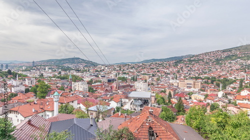 City panorama with cable car moving up and down from Sarajevo station to mountains, Bosnia And Herzegovina