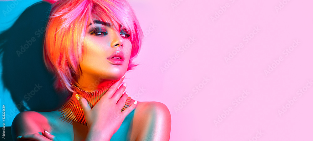 Fashion model woman in colorful bright lights, portrait of beautiful party girl with trendy make-up, manicure and haircut. Art design of disco dancer, colorful make up. Over colourful vivid background - obrazy, fototapety, plakaty 