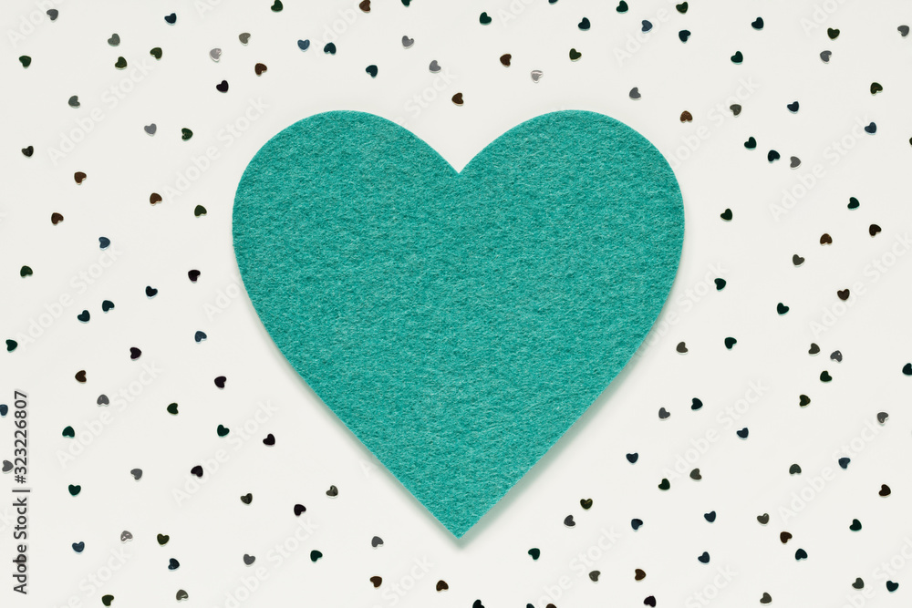 Green felt heart confetti background. Love romance passion symbol. Valentine's day romantic decoration Green felt heart confetti background. Love romance passion symbol. Valentine's day romantic decoration