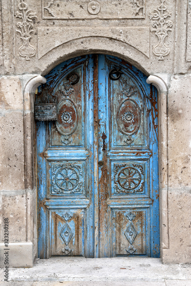Ancient wooden doors in the city of Ortahisar, Turkey.