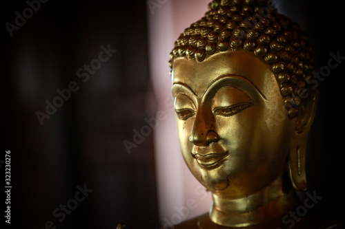 Selective focus  close-up shots of of the Buddha images with soft light and layout design for a beautiful religious background.