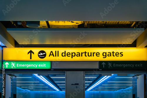 Departure gate sign in airport hall