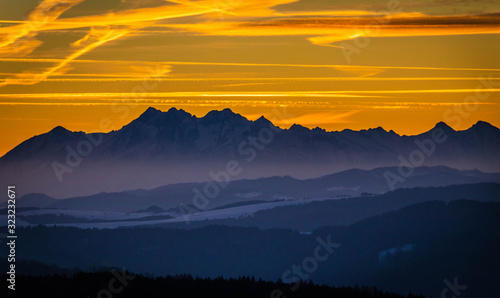 Fototapeta Naklejka Na Ścianę i Meble -  great sunshine at winter mountain with coloured sky 