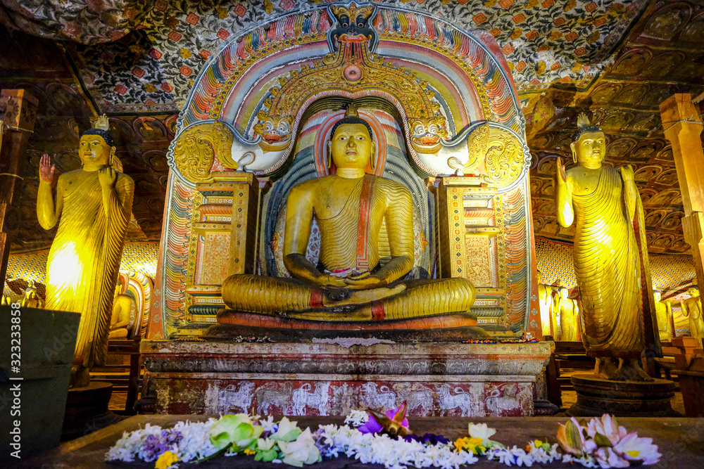 Buddha statue inside Dambulla cave temple on February 8, 2020 in Dambulla, Sri Lanka. Cave III Maha Alut Viharaya. Major attractions are spread over 5 caves, which contain statues and paintings.