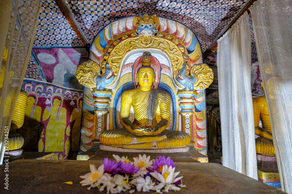 Buddha statue inside Dambulla cave temple in Dambulla, Sri Lanka. Cave IV Pachima Viharaya. Major attractions are spread over 5 caves, which contain statues and paintings.