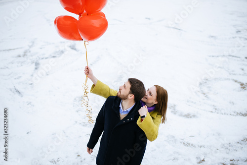 Canvas Print caucasian couple take a walk at winter street, celebrating saint valentines day outdoors