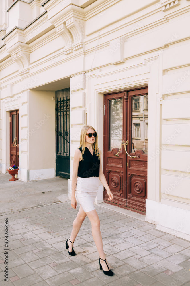 Young beautiful  woman walking on the street