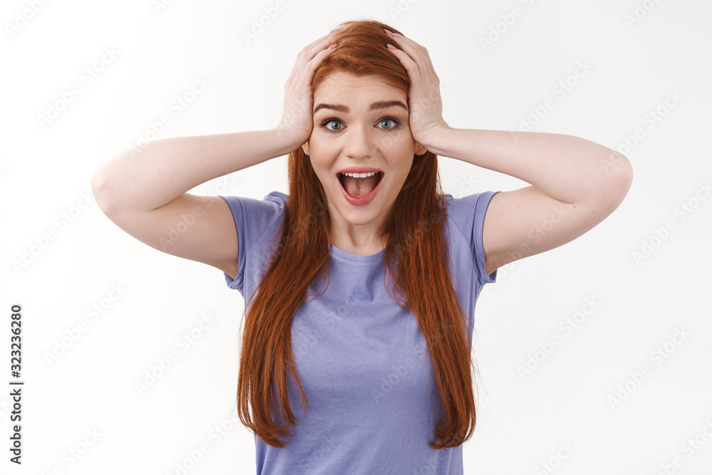 Surprised excited girl feeling overjoy and amazement, grab head and scream from astonishment and happiness, become winner of lottery, achieve goal, hear good news, rejoicing, white background Surprised excited girl feeling overjoy and amazement, grab head and scream from astonishment and happiness, become winner of lottery, achieve goal, hear good news, rejoicing, white background