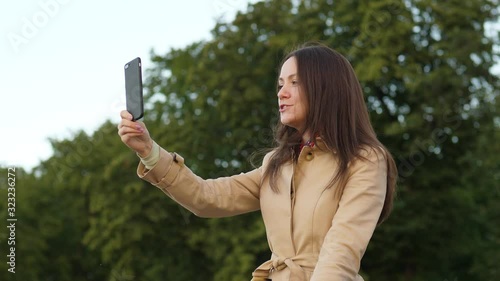 Woman talking with mobile, blogging, make stories
