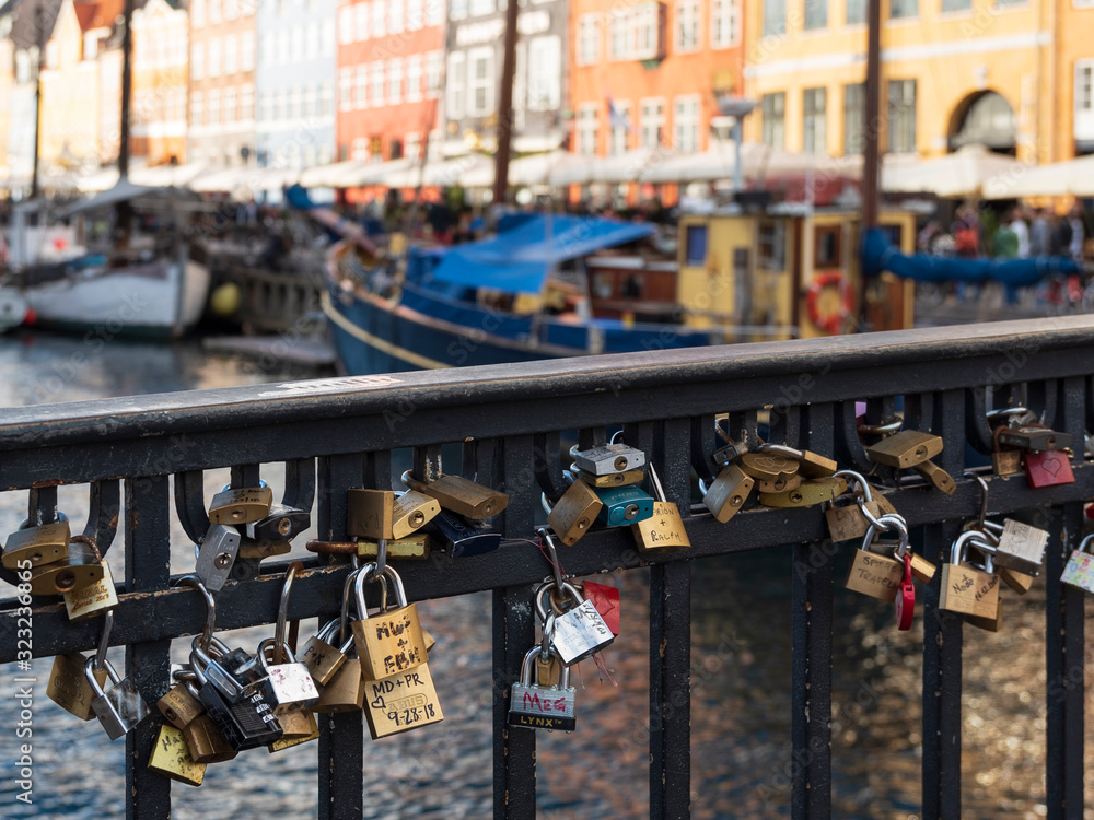 love locks on the railing of a bridge in nyhavn denmark