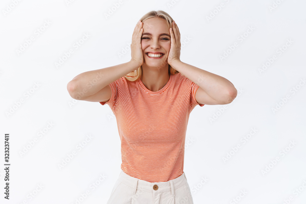 Carefree silly cute caucasian woman in striped t-shirt with tattoos, squeez cheeks and smiling joyfully, look pleased and cheerful, having fun, being happy enjoy life, white background Carefree silly cute caucasian woman in striped t-shirt with tattoos, squeez cheeks and smiling joyfully, look pleased and cheerful, having fun, being happy enjoy life, white background