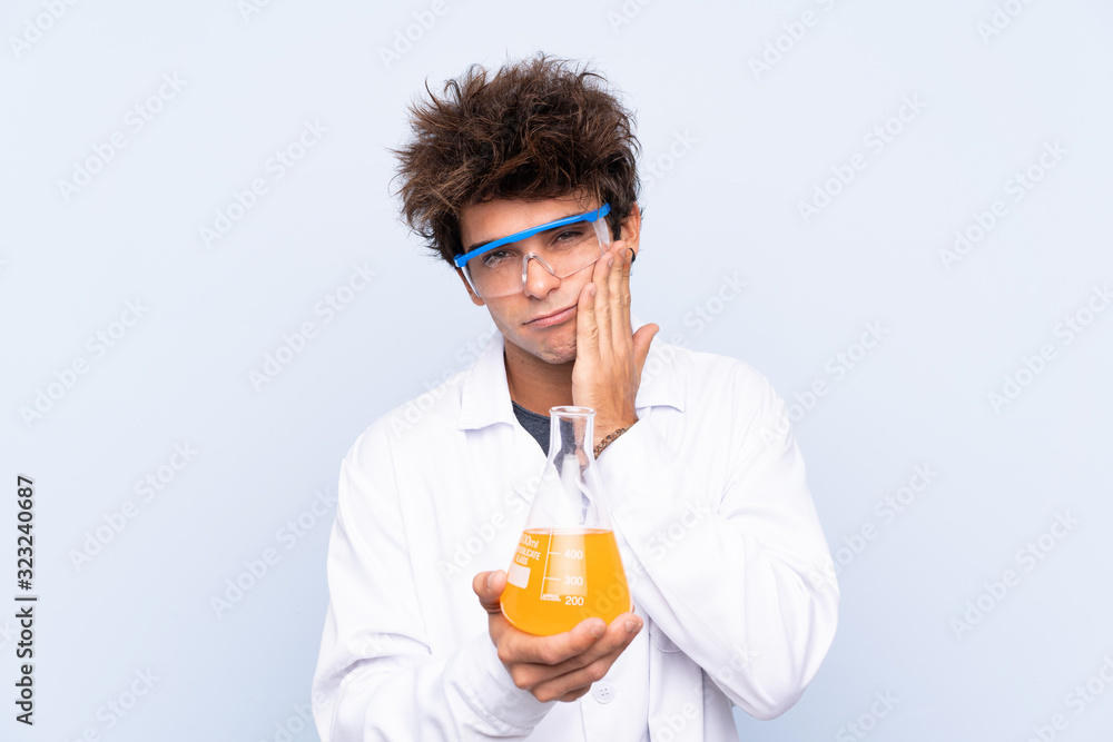 Young scientific man over isolated blue background unhappy and frustrated Young scientific man over isolated blue background unhappy and frustrated