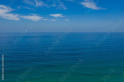 Light reflection on sea surface looking towards horizon View of horizon at Atlantic ocean at Fuerteventura, Canary islands, Spain. Aerial drone view