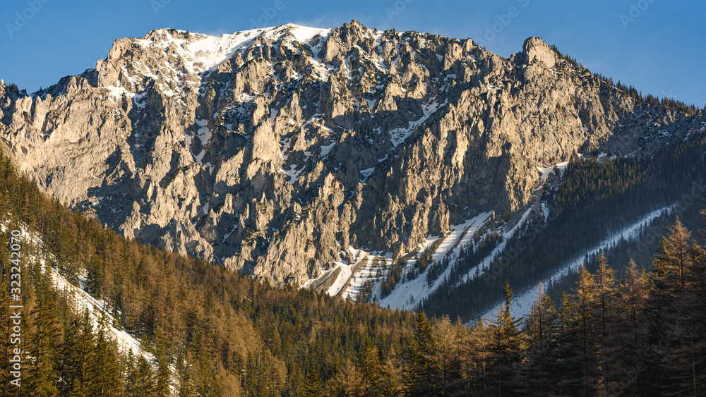 Peaceful mountain view of Hochschwab mountains Tragos, Oberort in Austria Styria. Tourist destination lake Gruner See in winter.