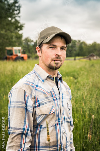 Portrait of farmer standing in his field. Red Lodge, Montana, USA photo