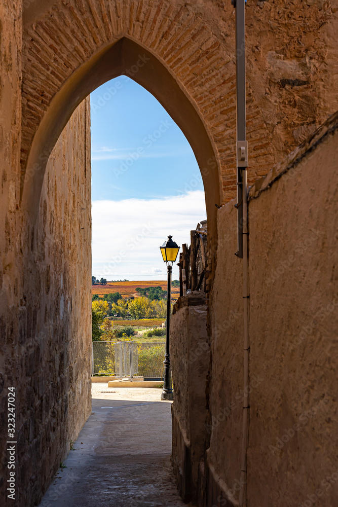 A gate on Calle Paniaqua overlooking the colorful hills around Requena, Spain