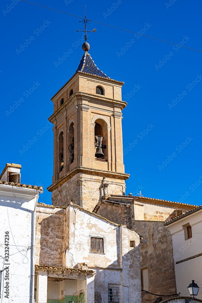 The church tower of Iglesia del Salvador seen from the Plaza de Albornoz Square in Requena, Spain