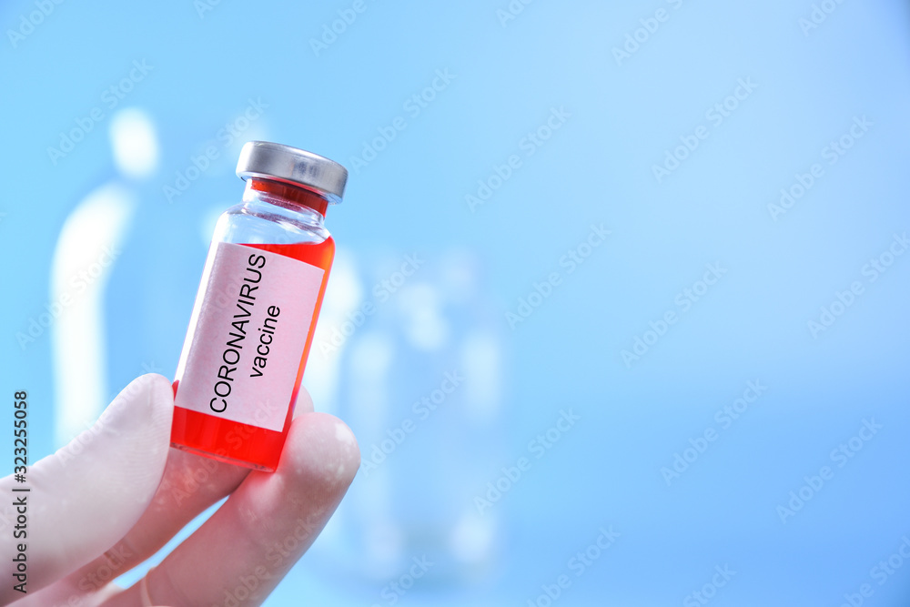 Doctor or nurse hand with nitrile glove holding coronavirus Covid 19 vaccine shot for vaccination, medicine and drug concept Doctor or nurse hand with nitrile glove holding coronavirus Covid 19 vaccine shot for vaccination, medicine and drug concept