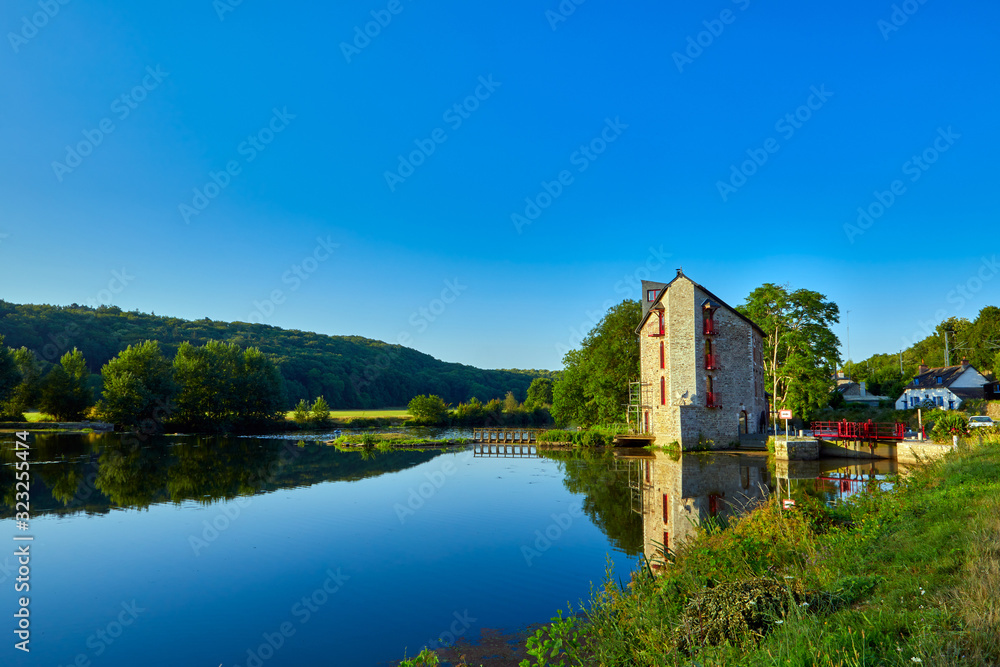 Image of La Villaine River and canal lock early morning with trees and grass Image of La Villaine River and canal lock early morning with trees and grass