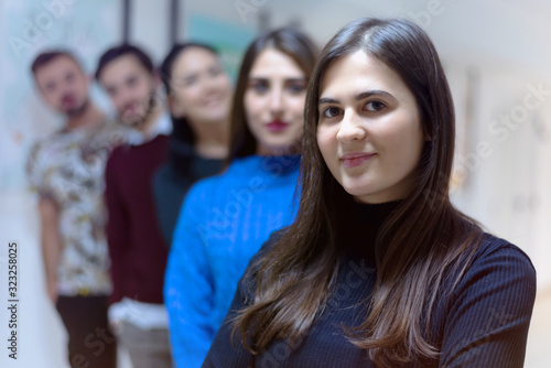 Business, education and sucess concept, Group of Young business people standing and looking at camera.