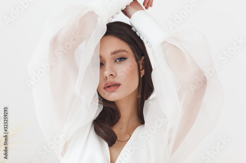 Portrait of elegant beautiful bride wearing fashion wedding dress. Perfect makeup and hairstyle