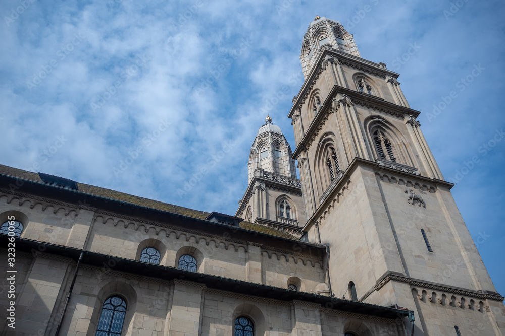 Fototapeta premium Two tower of Grossmunster the holy christ cathedral on sky with clouds background , copy space , Zurich , Switzerland