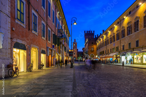 Old street with Pallazzo Communale (Palazzo Municipale) at night in Ferrara, Emilia-Romagna, Italy. Ferrara is capital of the Province of Ferrara
