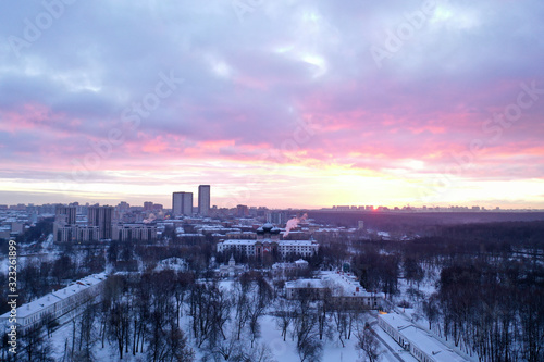 cityscape shot from a quadrocopter in winter at sunrise