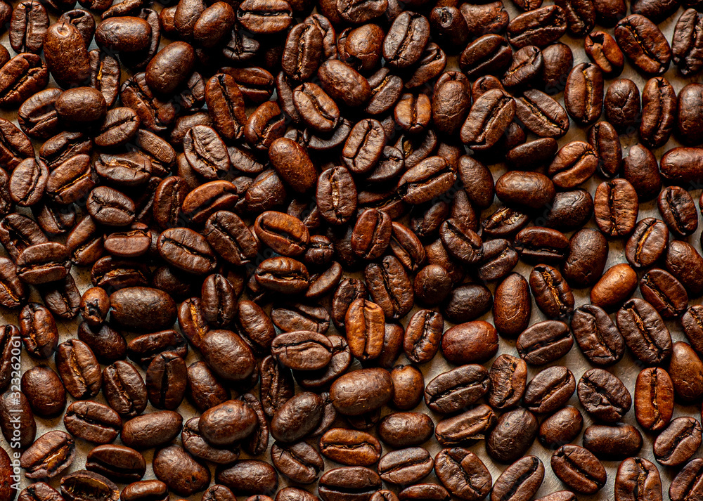 coffee beans on a wooden background coffee beans on a wooden background