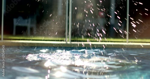 Woman taking a breath and submerging at the pool going underwater