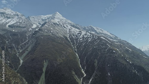 Aerial panorama of stunning snow Pisang Peak towering near Ghyaru village,Nepal  photo