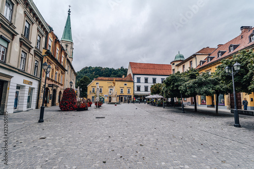 Celje, Slovenia - September 8th, 2019. Historical center of Celje with castle, municipal house and main square. photo