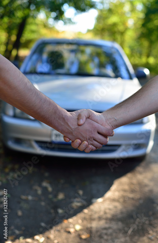 Car sale. Handshake