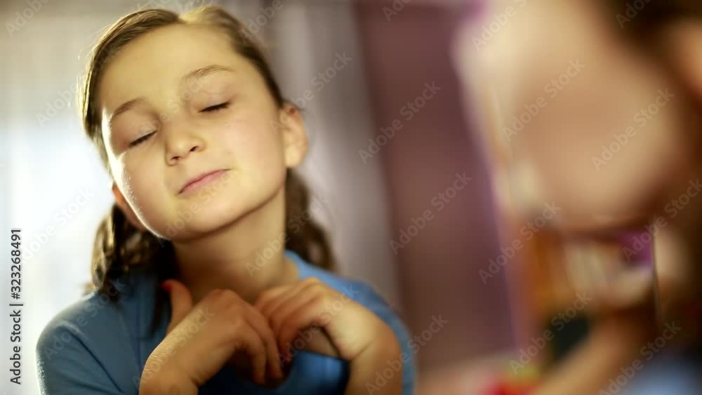 cute girl sitting and looking in the mirror. Teenage complexes. zits. unhappy with her appearance. making faces cute girl sitting and looking in the mirror. Teenage complexes. zits. unhappy with her appearance. making faces