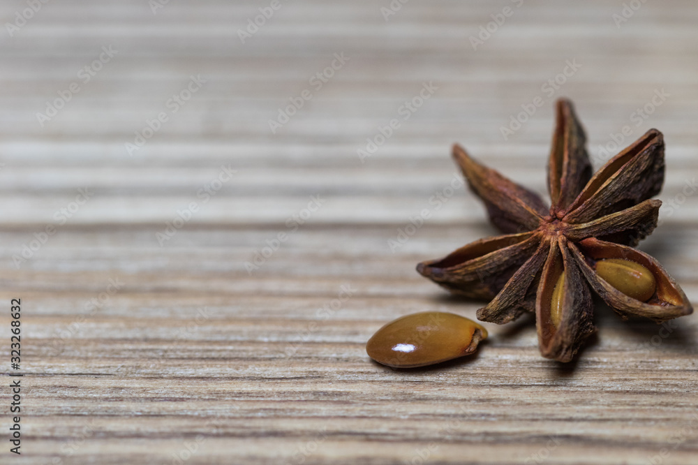 star anise with or without seed, closed, on a light wooden surface. spice for the recipe. beautiful picture, background. star anise with or without seed, closed, on a light wooden surface. spice for the recipe. beautiful picture, background.