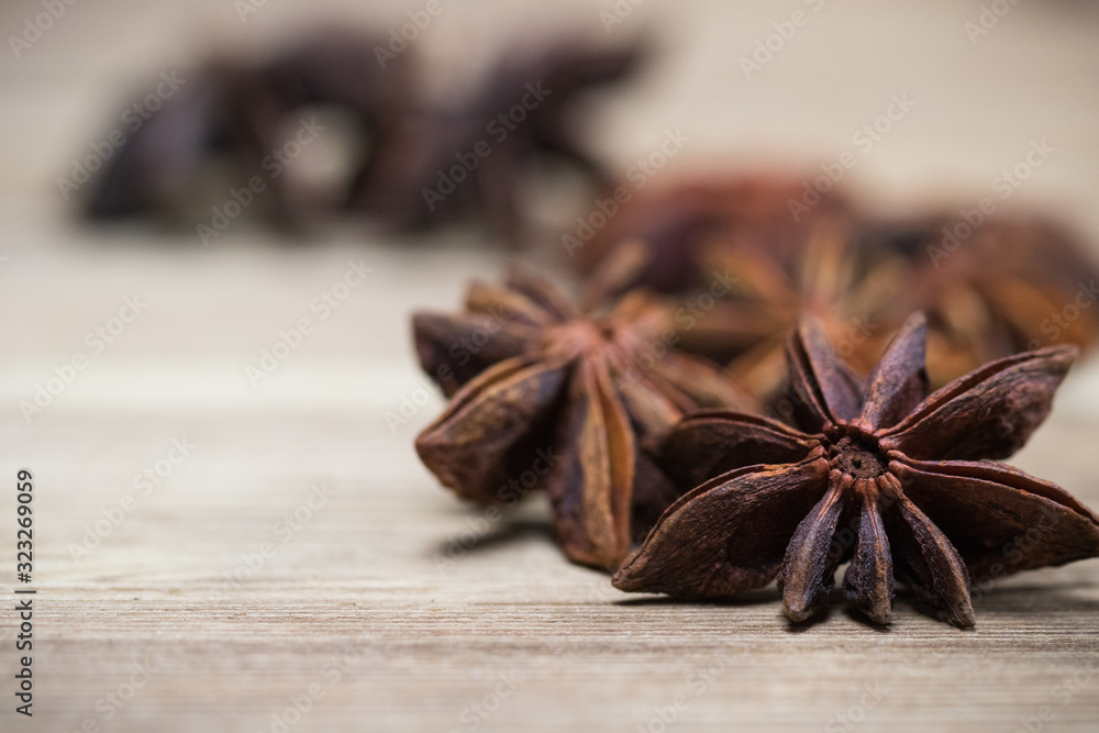 star anise with or without seed, closed, on a light wooden surface. spice for the recipe. beautiful picture, background. star anise with or without seed, closed, on a light wooden surface. spice for the recipe. beautiful picture, background.