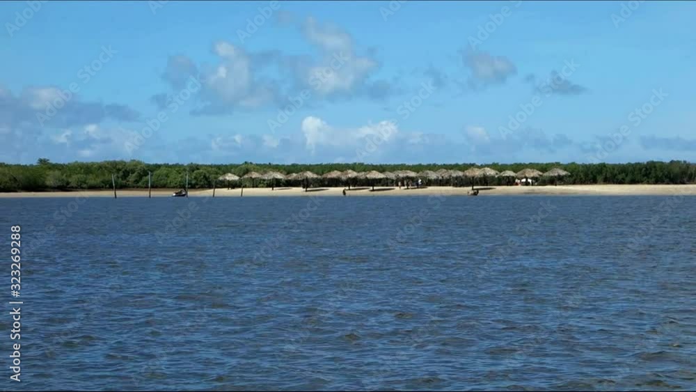 Private river beach, huts and trees, at Sergipe, Brazil Private river beach, huts and trees, at Sergipe, Brazil