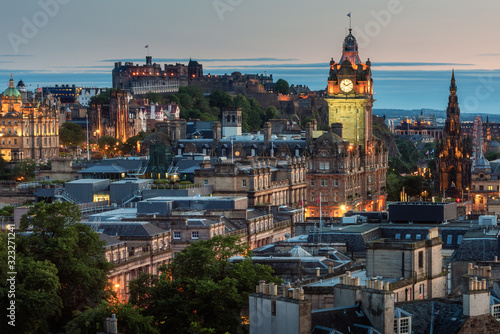 Balmoral s clock tower with Edinburgh cityscape skyline and Edinburgh castle background during sunset