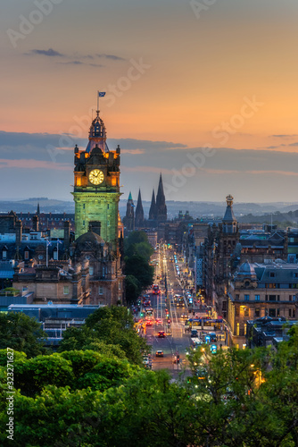 Balmoral s clock tower with Edinburgh cityscape skyline and Scott Monument background during sunset