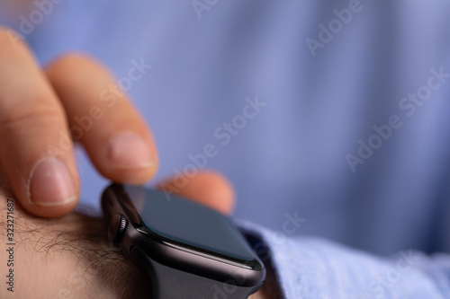 Close up of Businessman's hand looking at hand watch © vegefox.com