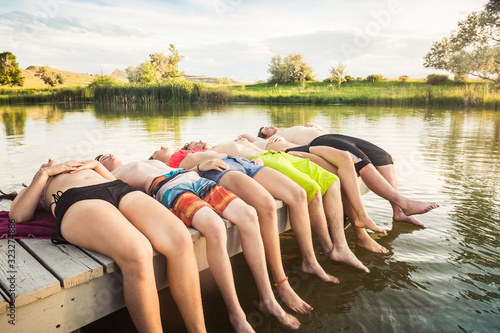 Group of friends relaxing and having fun at a swimming hole. Bridger, Montana, USA photo