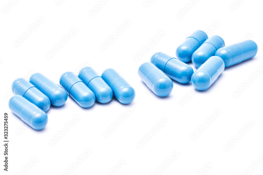 Blue capsules isolated on white. Medicine healthcare background. Drugs dose in group. Painkiller pills pile. Pharmacy virus cure. Empty copy space medicament in group backdrop. Blue capsules isolated on white. Medicine healthcare background. Drugs dose in group. Painkiller pills pile. Pharmacy virus cure. Empty copy space medicament in group backdrop.