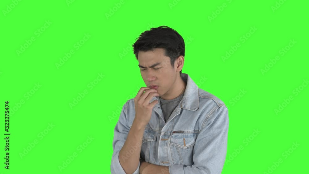 Young man pondering something in the studio Young man pondering something in the studio