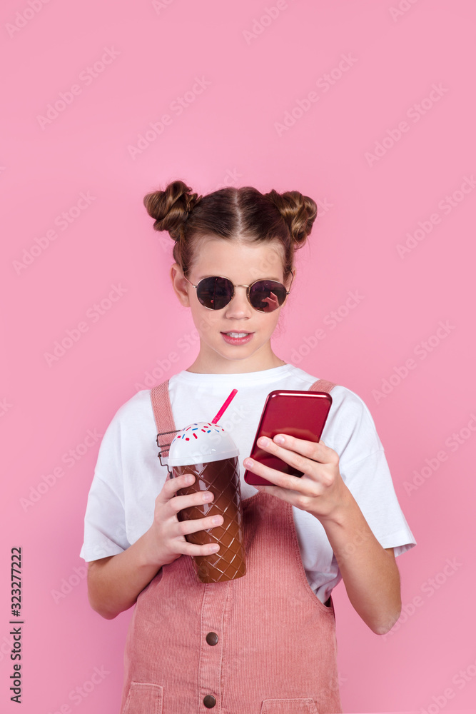 Beautiful young girl in sunglasses using mobile phone Beautiful young girl in sunglasses using mobile phone