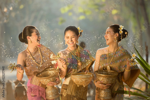 Thai girls and laos girls splashing water during festival Songkran ,Thailand